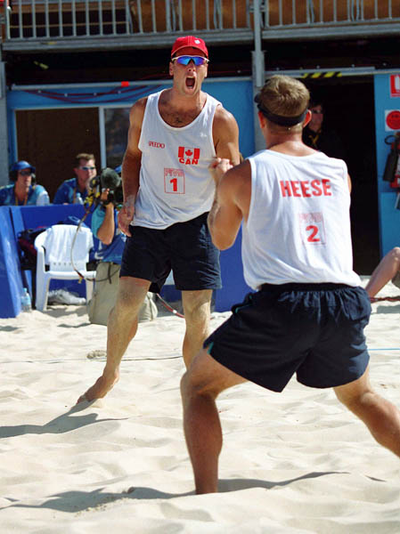 Canada's Mark Heese and John Child play a set of beach volleyball at the 2000 Sydney Olympic Games. (CP Photo/ COA)