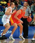 Canada's Greg Newton (left) participates in basketball action at the 2000 Sydney Olympic Games. (CP Photo/ COA)