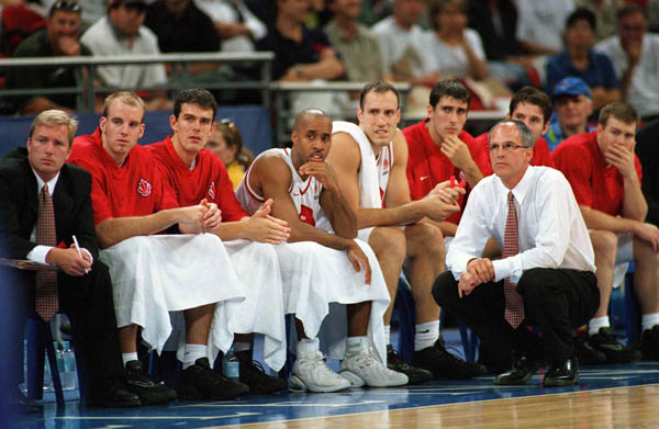 Canada's basketball team and coach Jay Triano keep close watch of the action at the 2000 Sydney Olympic Games. (CP Photo/ COA)