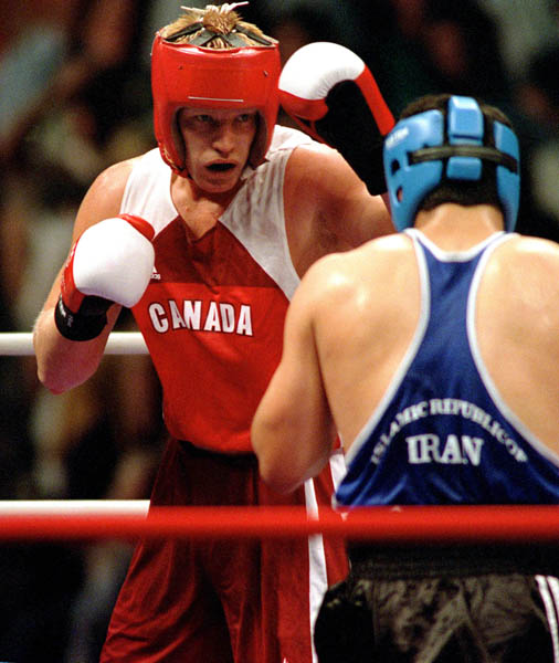 Canada's Mark Simmons (left) competes in the boxing event of the 2000 Sydney Olympic Games. (CP Photo/ COA)