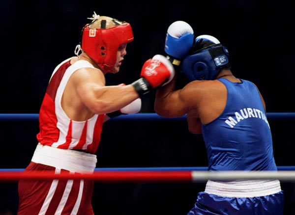 Canada's Artur Binkowski (left) competes in the boxing event of the 2000 Sydney Olympic Games. (CP Photo/ COA)
