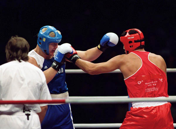 Canada's Artur Binkowski (left) competes in the boxing event of the 2000 Sydney Olympic Games. (CP Photo/ COA)
