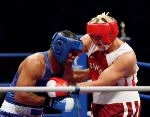 Canada's Troy Amos throws a punch during a boxing match at the Sydney 2000 Olympic Games. (CP PHOTO/ COA)