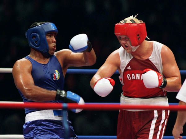 Canada's Artur Binkowski (right) competes in the boxing event of the 2000 Sydney Olympic Games. (CP Photo/ COA)