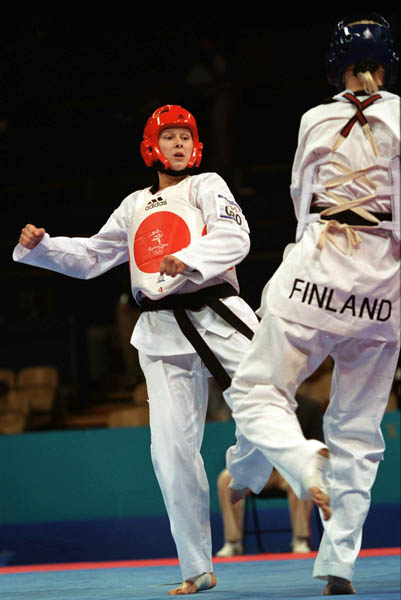 Canada's Dominique Bosshart (left) competes in the Taekwondo event of the 2000 Sydney Olympic Games. (CP PHOTO/ COA)