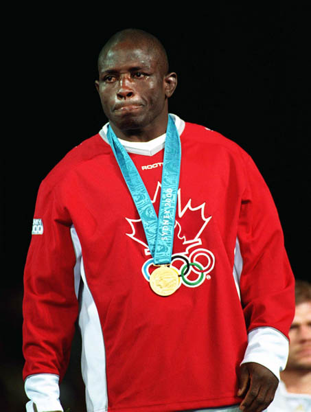 Canada's Danial Igali celebrates his gold medal win in the wrestling event at the 2000 Sydney Olympic Games. (CP PHOTO/ COA)