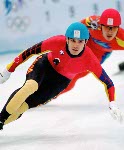 Canada's Derrick Campbell (left) competes in the short track speed skating event at the 1998 Nagano Winter Olympic Games. (CP Photo/ COA/ Scott Grant)