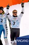 Canada's Ross Rebagliati (centre) celebrates after winning the gold medal in the snowboard event at the 1998 Nagano Olympic Games. (CP Photo/ COA)