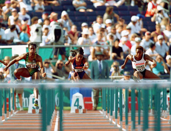 Canada's Katie Anderson (right) competes in an athletics event at the 1996 Olympic games in Atlanta. (CP PHOTO/ COA/Claus Andersen)