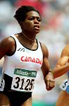 Canada's Lesley Tashlin (left) and Ladonna Antoine competes in an athletics event at the 1996 Olympic games in Atlanta. (CP PHOTO/ COA/Claus Andersen)