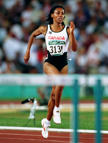 Canada's Rosey Edeh competes in the 400m hurdles during athletics competition at the 1996 Olympic games in Atlanta. (CP PHOTO/ COA/Claus Andersen)