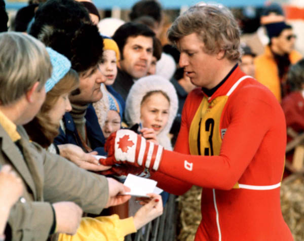 Canada's Jim Hunter signs autographs during ski jumping competition at the 1976 Winter Olympics in Innsbruck. (CP Photo/COA)