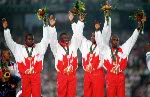 Canada's men's 4x100m relay gold medal winners (left to right) Bruny Surin, Glenroy Gilbert, Donovan Bailey and Robert Esmie celebrate at the 1996 Atlanta Summer Olympic Games. (CP PHOTO/COA/Claus Andersen)