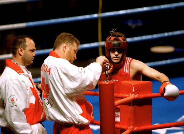 Canada's Gord Apolloni (centre) coaches at the boxing event at the 1996 Atlanta Summer Olympic Games. (CP Photo/COA/Scott Grant)