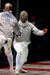 Canada's Jean-Marie Banos (right) competes in the fencing event at the 1996 Atlanta Summer Olympic Games. (CP Photo/ COA/F. Scott Grant)