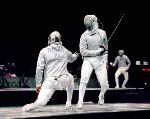 Canada's Jean-Marie Banos (right) competes in the fencing event at the 1996 Atlanta Summer Olympic Games. (CP Photo/ COA/F. Scott Grant)