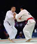Canada's Taro Tan (left) competes in the judo event at the 1996 Atlanta Summer Olympic Games. (CP Photo/COA/F. Scott Grant)