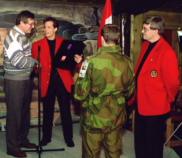 Kurt Browning (second from left) assists at his nomination as Canada's flag bearer for the opening ceremonies at the 1994 Winter Olympics in Lillehammer. (CP Photo/COA/F. Scott Grant)
