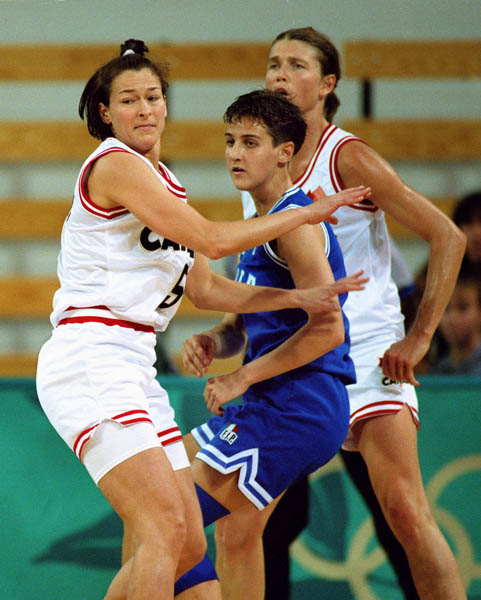 Canada's Karla Karch (left) performs in  women basketball action at the 1996 Atlanta Summer Olympic Games. (CP Photo/COA/Scott Grant)