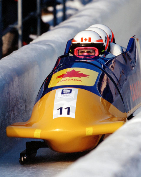 Canada's Pierre Lueders, Dave MacEachern, Jack Pyk and Pascal Caron compete in the four-man bobsleigh event at the 1994 Lillehammer Winter Olympics. (CP Photo/COA/F. Scott Grant)