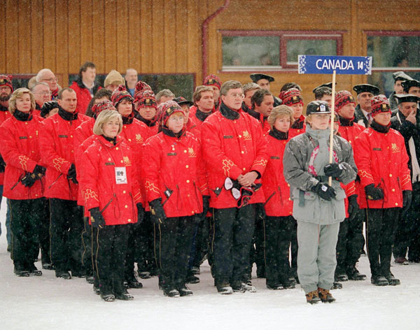 The Canadian Olympic team led by chef de mission Bill Warren (centre) stands at the 1994 Lillehammer Winter Olympics. (CP Photo/COA/F. Scott Grant)