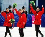 Canada's women's short track relay team, Isabelle Charest, Sylvie Daigle, Christine Boudrias and Nathalie Lambert, celebrates its silver medal win at the 1994 Lillehammer Winter Olympics. (CP Photo/COA/F. Scott Grant)