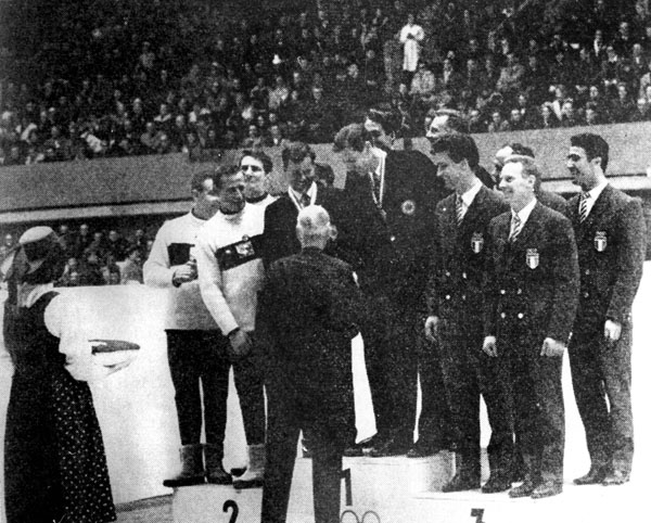 Canada's four-men bobsleigh team, Doug Anakin, Vic Emery, John Emery and Peter Kirby (center), celebrates its gold medal performance at the 1964 Innsbruck winter Olympics. (CP Photo/COA)