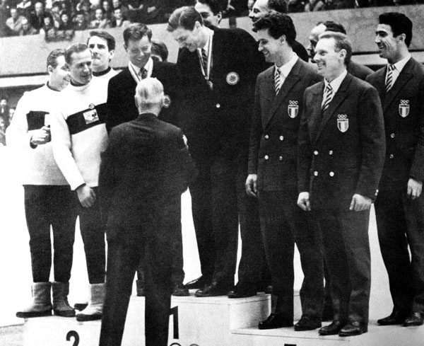 Canada's bobsleigh team Doug Anakin, Vic Emery, John Emery and Peter Kirby (centre) celebrate their gold medal win at the 1964 Innsbruck winter Olympics. (CP Photo/COA)