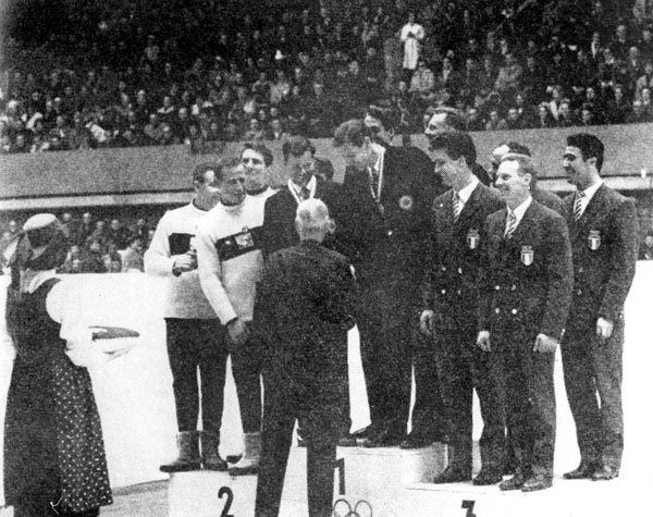 Canada's four-men bobsleigh team, Doug Anakin, Vic Emery, John Emery and Peter Kirby (center), celebrates its gold medal performance at the 1964 Innsbruck winter Olympics. (CP Photo/COA)