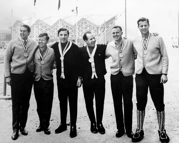 Canada's John and Vic Emery (right), of the four-men bobsleigh team, celebrate their gold medal win at the 1964 Innsbruck winter Olympics. (CP Photo/COA)