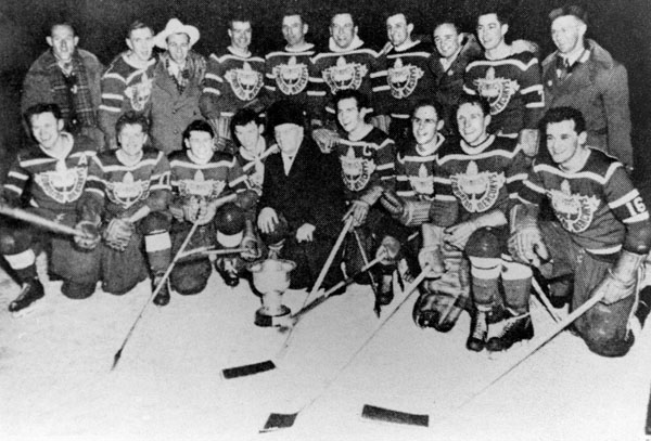 Canada's hockey team, represented by the Edmonton Mercurys, celebrates its gold medal win at the 1952 Oslo winter Olympics. (CP Photo/COA)