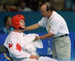 Canada's Dominique Boshart and her taekwondo coach Joo Won Kang at the 2000 Sydney Olympic Games. (Mike Ridewood/CP Photo/ COA)