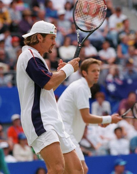 Canada's Sebastian Lareau (foreground) and Daniel Nestor compete in a match of men's doubles tennis at the 2000 Sydney Olympic Games. ( Mike Ridewood/CP Photo/ COA)