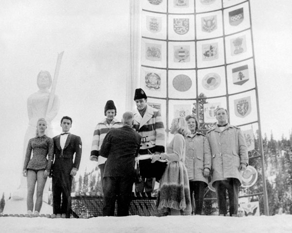 Canada's Barbara Wagner and Robert Paul (centre) celebrate their gold medal in the figure skating event at the 1960 Squaw Valley Olympics. (CP Photo/COA)