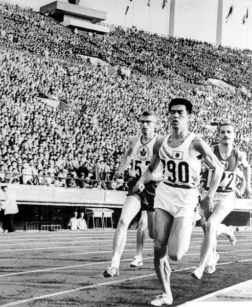 Canada's Bill Crothers (left) competes in an athletics event at the 1964 Tokyo Olympics. (CP Photo/COA)