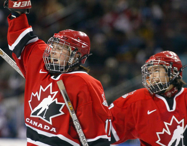 Jennifer Botterill of Winnipeg (left) celebrates her goal, Canada's sixth, with teammate Dana Antal of Esterhazy, Sask. in a 7 - 0 win over Russia  at the Winter Olympics in Salt Lake City, Utah, Wed., Feb. 13, 2002. (CP Photo/COA/Mike Ridewood)