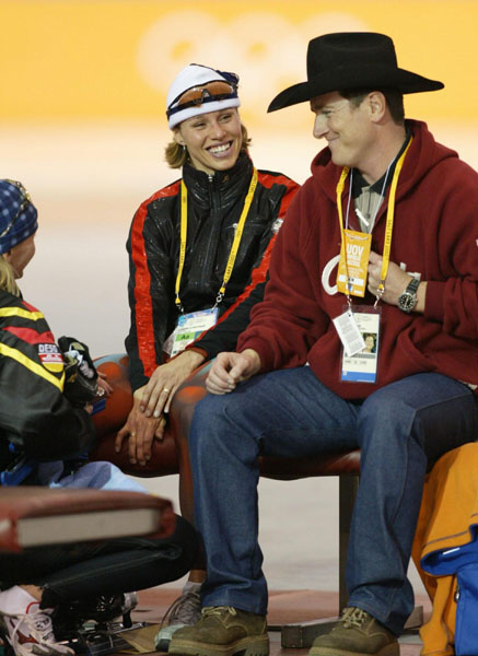 Catriona Le May Doan (centre) is congratulated by her husband Bart Doan (right) and Sabine Voelker of Germany after setting an Olympic record of 37.30 in the 500 metres speed skating race at the Winter Olympics in Salt Lake City, Wed., Feb. 13, 2002.  The