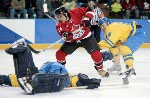Sweden goalie Tommy Salo stops Canada's Mario Lemieux from close range during a 5-2 Swedish win in men's hockey action at the Winter Olympics in Salt Lake City, Fri., Feb. 15, 2002.  (CP PHOTO/COA/Mike Ridewood)