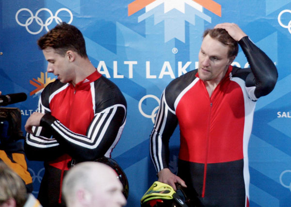 Canada's Pierre Leuders (right) and Giulio Zardo stand in the finish area after a fifth place in two man bobsleigh at Utah Olympic Park during the Winter Olympics, Sun., Feb. 17, 2002, 2002.   (CP PHOTO/COA/Mike Ridewood)