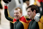 Christoph Langen (front) and Markus Zimmermann of Germany celebrate their gold medal run of two man bobsleigh at Utah Olympic Park during the Winter Olympics, Sun., Feb. 17, 2002, 2002.  (CP PHOTO/COA/Mike Ridewood)