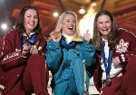Freestyle skiing aerials medallists, bronze, Deidre Dionne (left) of Red Deer, gold, Alisa Camplin of Australia and silver, Veronica Brenner (right) of Sharon, Ont., pose for photographers with their medals in Salt Lake City, Utah during the Winter Olympi