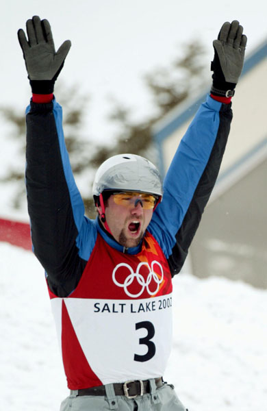 Ales Valenta of the Czech Republic lands the first ever triple flip with five twists at the Olympics to take the gold medal in the men's aerials final at Deer Valley, Utah during the Winter Olympics, Tues., Feb. 19, 2002.  (CP PHOTO/COA/Mike Ridewood)