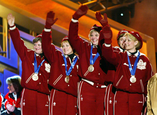 Canadian Womens Curling team (left to right)  Cheryl Noble, of Victoria, Diane Nelson, of Burnaby, B.C., Georgina Wheatcroft, of of Victoria, Julie Skinner, of Victoria,  and skip Kelley Law, of Coquitlam, B.C., wave to the crowd after winning bronze meda
