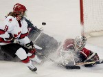 Canada's Jayna Hefford scores the team's third goal over United States goaltender Sara Decosta in the second period of a 3 - 2 Canada win for the gold medal  over the United States in Salt Lake City , Utah during the Winter Olympics, Thursday, Feb. 21, 20
