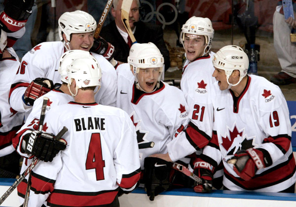 Canada's Mario Lemieux (66), Paul Kariya (centre), Simon Gagne (21), Steve Yzerman (19) and Rob Blake (4) celebrate Canada's men's hockey team gold medal win 5 - 2 over the U.S. to take the gold medal at the Winter Olympics in West Valley City, Utah, Sun.