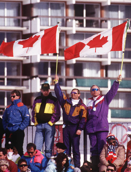 Canada's supporters in the crowd wave the Canadian flag at the 1992 Albertville Winter Olympics. (CP PHOTO/COA)