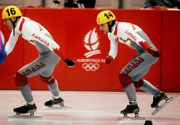 Canada's Mark Lackie (left) and Michel Daigneault competing in the short track speed skating event at the 1992 Albertville Olympic winter Games. (CP PHOTO/COA/Ted Grant)