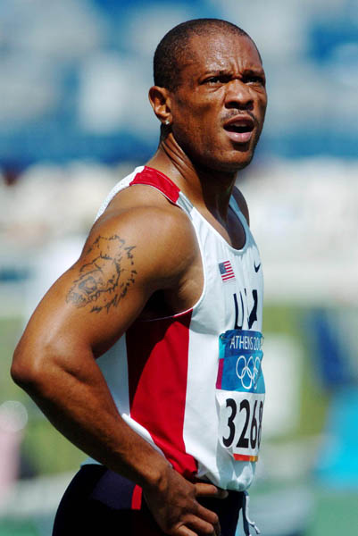 Maurice Greene, of U.S.A., reacts after racing the 100m qualifing heat at the Athens 2004 Summer Olympic Games Saturday, August 21, 2004. (CP PHOTO/COC-Andre Forget)
