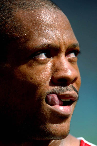 Maurice Greene, of U.S.A., reacts after racing the 100m qualifing heat at the Athens 2004 Summer Olympic Games Saturday, August 21, 2004. (CP PHOTO/COC-Andre Forget)
