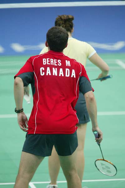 Canada's Mike Beres of Mt. Pleasant, Ontario, has his eyes on the birdie during badminton training for the summer Olympic Games in Athens, Greece, Tuesday, August 10, 2004.(CP PHOTO)2004(COC-Mike Ridewood)